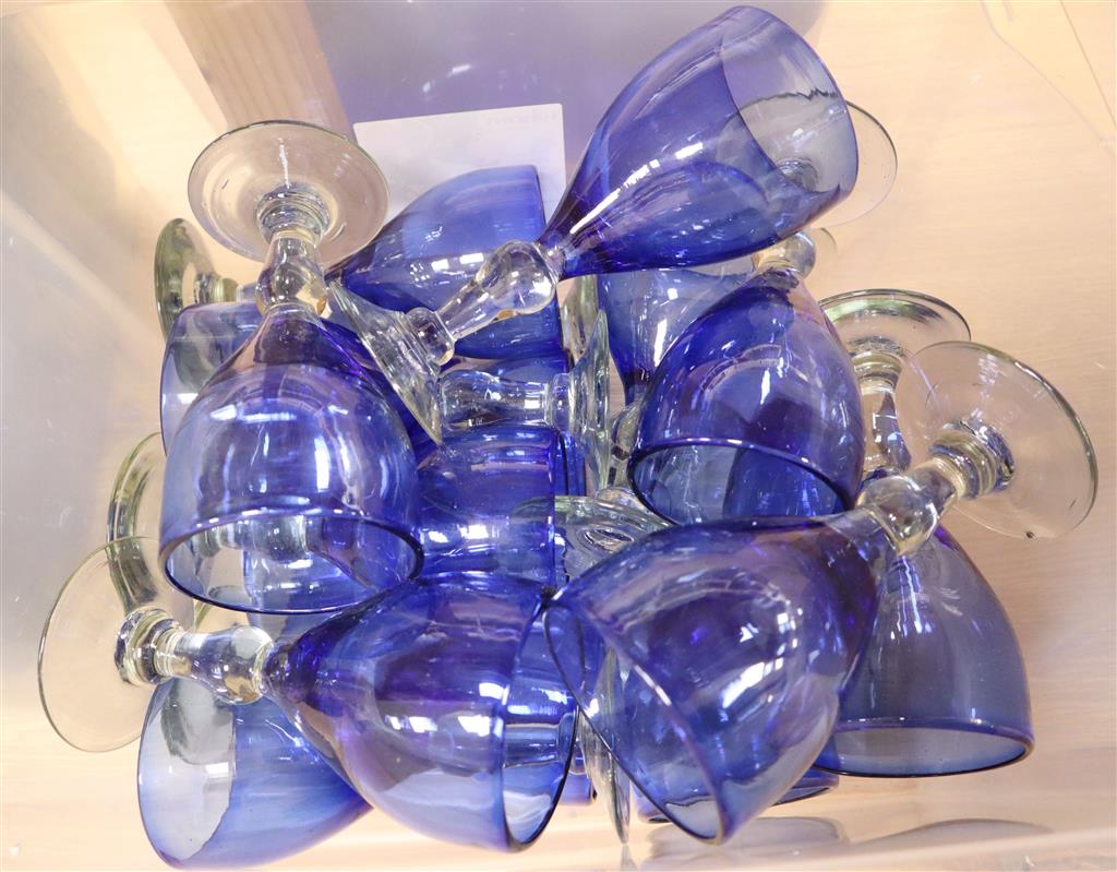 A collection of black, clear blue and crystal blue drinking glasses